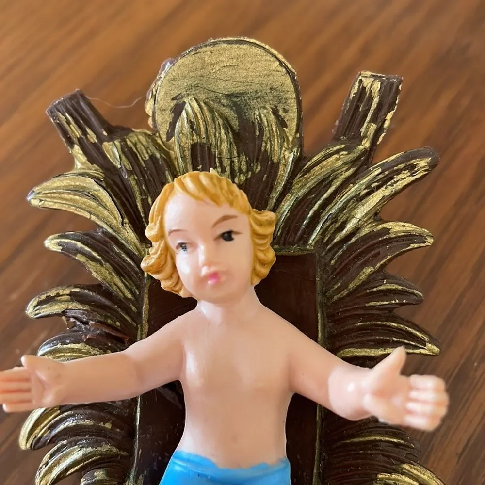 Vintage plastic baby Jesus in manger bed‎